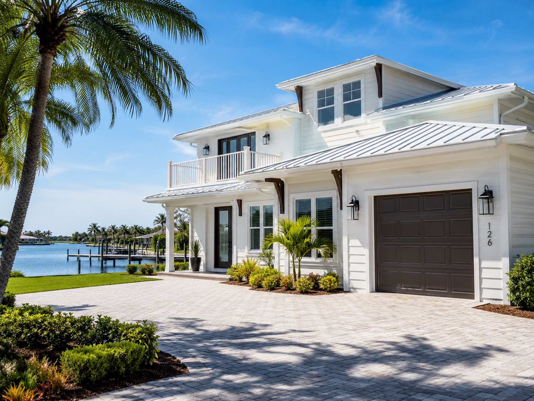 Illustrative house wash result — clean white coastal home exterior.