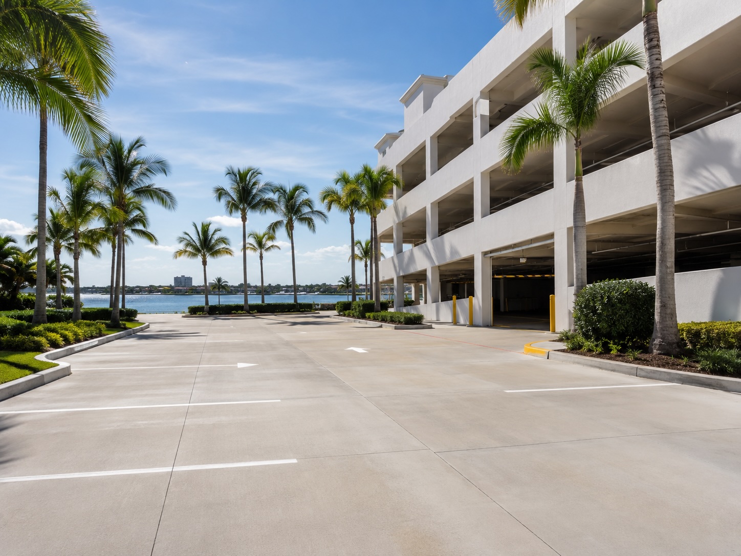 Illustrative parking surface rinse — clean lot markings and garage shell.