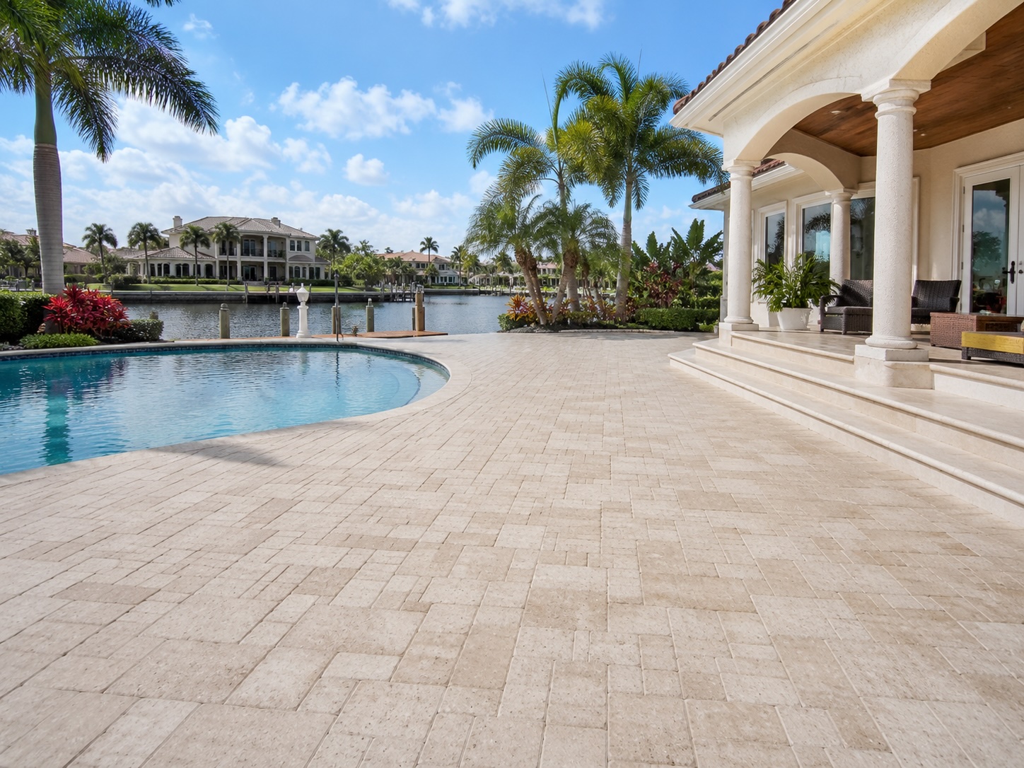 Illustrative paver and hardscape care — clean interlocking stone driveway.