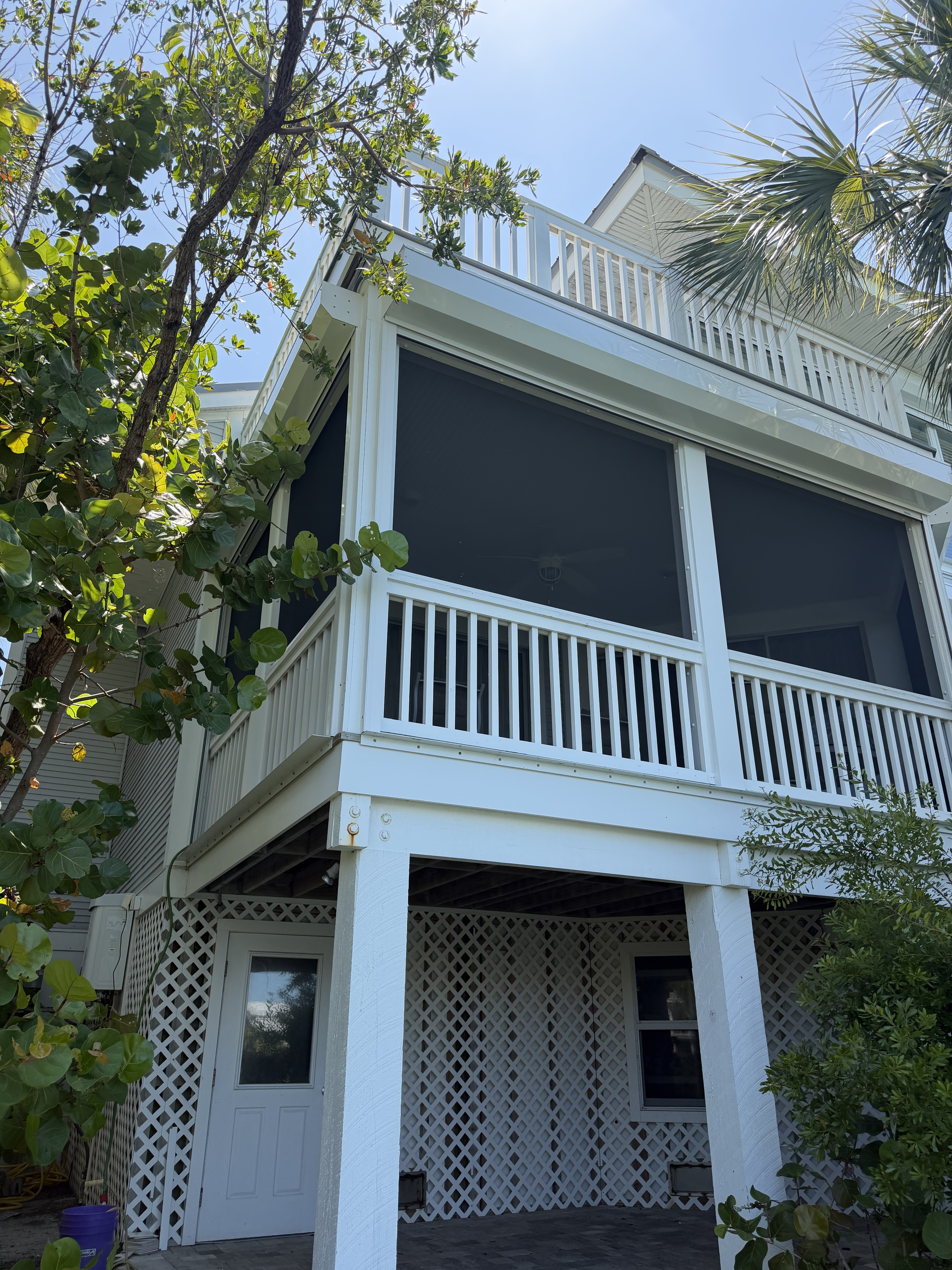 Residential exterior — clean siding, trim, and coastal shell.