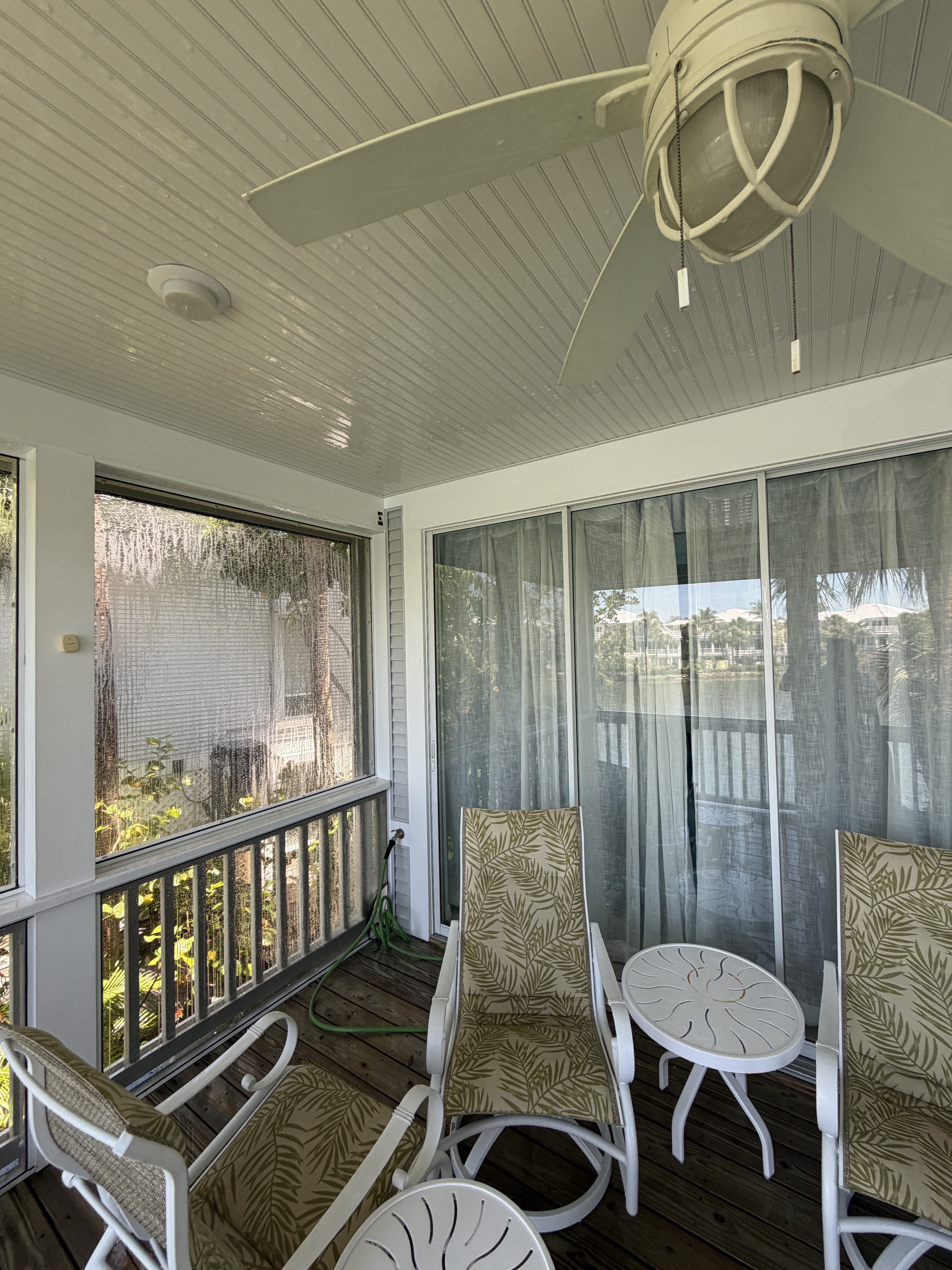 Screened porch and balcony — clean mesh, rails, and outdoor living space.